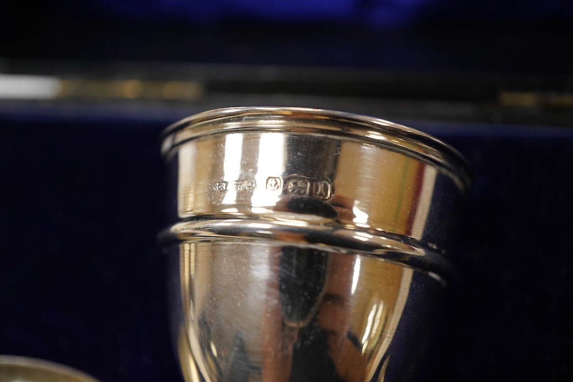 A George VI silver sugar bowl, Viners Ltd, Sheffield, 1946, diameter 10.9cm, together with a cased silver spoon & pusher and a silver mounted glass liquor jug.
